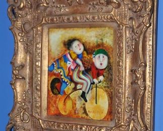 Artist Signed, Transfer on Board. Framed in Ornate Gold Frame, "Two Children on a Bike".  16" x 18"