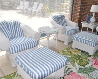 Lloyd Flanders White Wicker 5-Pc. Outdoor Furniture Set includes a Pair of Arm Chairs, W38" x H32.5" x D40", a pair of Ottomans, W28" x H18" x D28" and a Round White Wicker Side Table with a Glass Top, W24" x H24" x D24". 