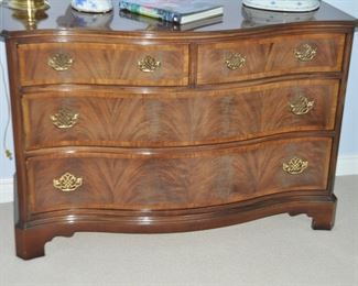 Up Close View of the Vintage American Masterpiece Collection by Hickory Furniture, a Chippendale-Style Banded, Serpentine Flame Mahogany 4-Drawer Chest.  W50" x H34" x D21"