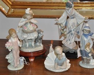Wonderful Group of Vintage Lladro Porcelain Figurines, including "Spring Girl" with a Basket of Flowers, "Japanese Girl with Umbrella",  "Girls with Flower and Dog",  "Winter Boy with Dog" and Relaxing Ballerina
