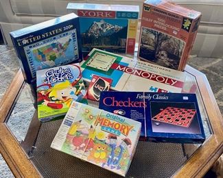c.1961 Monopoly game, Checkers, Memory game, Chutes and Ladders, and several 1,000-Piece Puzzles