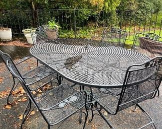 $340  Wrought Iron Oval Outdoor table and six chairs. 72" x 42".