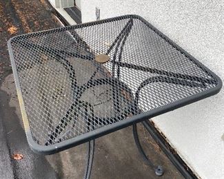 $60  Square wrought iron outdoor table 28" square.