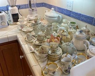 Lots of teacups and and teapots for sale in-person.