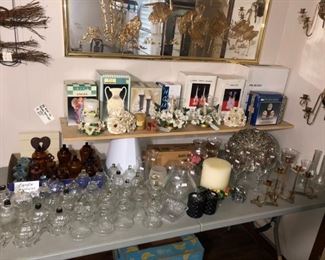 Table full of glassware and some things in boxes