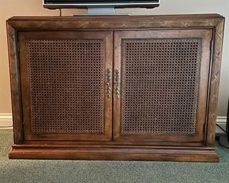 Vintage Cane-Front Two-Door Cabinet with Lattice Trim. Great As Is But Ask Us About Custom Painting. Measures Approximately 36" W x 20" D x 31" H. Photo 1 of 4. 