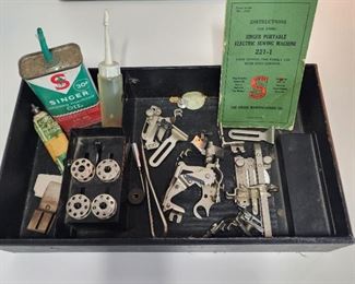 1941 Singer Featherweight sewing machine with case, keys, accessories, owners manual and extra feet.