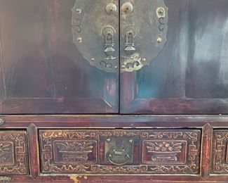 Vintage Asian cabinet carved detail and metal hardware
