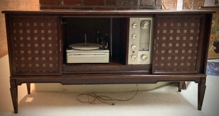 Vintage Console with built in Stereo, Record Player, and Speakers. This item has all its original components.