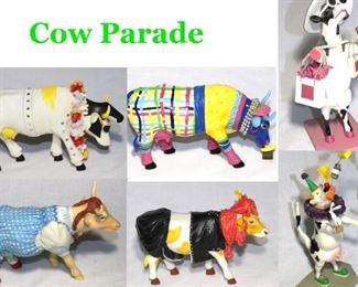 several Cow Parade figurines