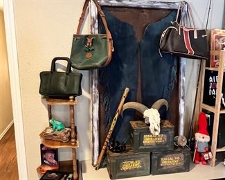 Dooney & Burke purse, 2 coach bags… one probably 70’s! Framed suede Chaps, ammo boxes. 