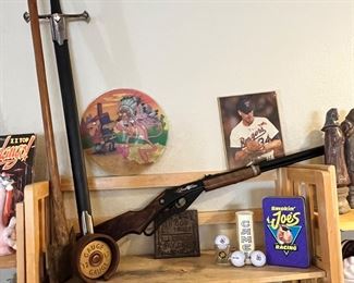 Red rider BB gun, Joe camel stuff… tin, golf balls, shit glass, large metal sword, huge axe, pink panther record, Nolan Ryan who is obviously a total B.A.!