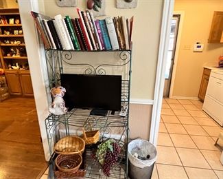 Cute folding bakers rack or shelf full of cook books and baskets 