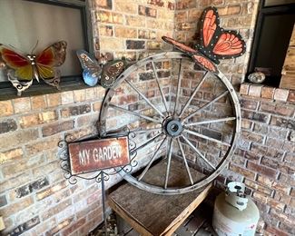 Some cool outdoor butterflies and a great old wooden wagon wheel… reminds me of the song Wagon Wheel co-written by Bob Dylan  & Ketch Secor of Old Crow Medicine Show… yeah, the one Hootie later popularized after ditching the poor blowfish and putting on his “Darius Rucker” costume, but I swear the Old Crow version is better… I challenge you to listen to both and explain to me how Hootie made it better in any way. I’m just saying… pray for Old Crow Medicine show. They are amazing and I want another album and a regional tour.