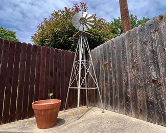Very big windmill… another you buy and you undo the bolts concept. Should be an easy removal and will look great where ever you put it.