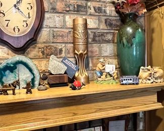 A literal piece of Alcatraz! World war one train chart floral vase made from large caramel shell casing, Smokey the bear figurine educating a little ones, trolley car pencil sharpener, carved soapstone double vase