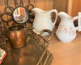 One of several small mirrors and pitchers
