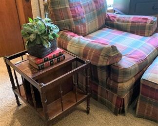 One of two plaid club chairs with ottoman; wood side table/magazine rack