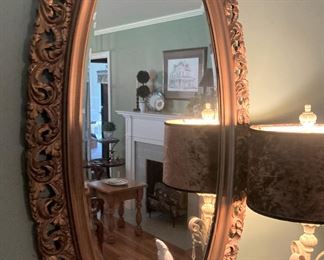 Gold oval mirror