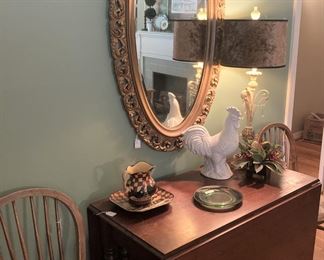 Antique dropleaf table; Windsor chairs; oval mirror