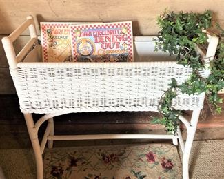 White wicker planter; Mary Engelbreit cookbooks
