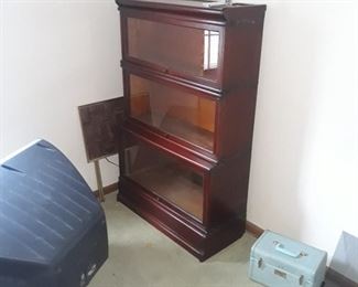 We have a similar  barrister bookcase available.  Same  height with three shelf units , slightly different 