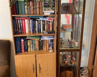 Curio cabinet and book shelf and perfume bottles