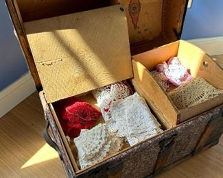 Antique trunk with antique linens