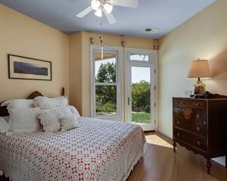 antique bed with dresser and antique spread