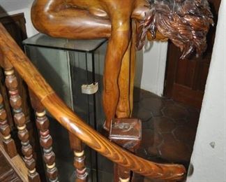 A life size carved wood artwork by Linda Elder.  Title:  PARADOX or A HARD HEADED WOMAN.