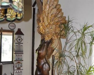 A 9 1/2 foot tall single piece  carved wood artwork by David  Elder.  Title:  Winged Victory