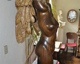 A 9 1/2 foot tall single piece  carved wood artwork by David  Elder.  Title:  Winged Victory