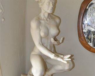 A 3 1/2 foot tall original plaser/ceramic sculpture  by Linda Elder mounted on a 4 foot tall pedestal.  Title:  Crouching Woman