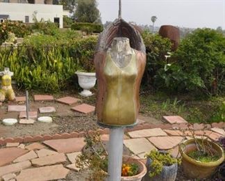 Carved wood winged torsos/figures created by David Elder.