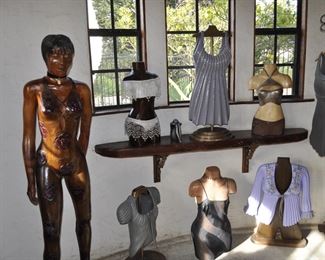 Asst. carved wood torsos and figures created by David Elder.