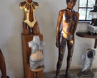 Asst. carved wood torsos and figures created by David Elder.