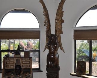 A 9 1/2 foot tall single piece  carved wood artwork by David  Elder.  Title:  Winged Victory