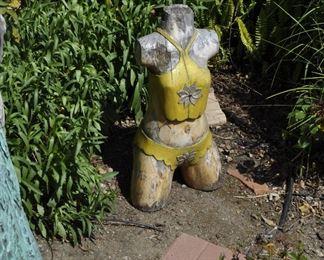 Carved wood winged torsos/figures created by David Elder.