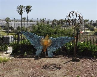 Carved wood winged torsos/figures created by David Elder.