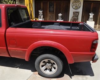 2003 Ford Ranger long bed with V6 - 215,000 miles.  Runs good with good tires and priced right.