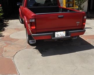 2003 Ford Ranger long bed with V6 - 215,000 miles.  Runs good with good tires and priced right.
