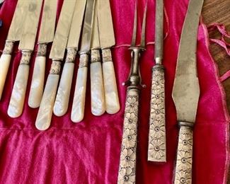 Set of 8 antique pearl-handled butterknives with sterling collars and antique sterling repoussé carving set