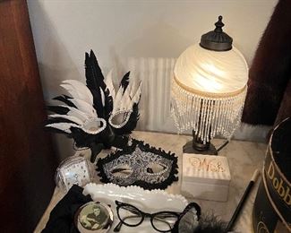 Mardi Gras feather masks
Cigarette holder
Cat eye glasses
Glass shade lamp