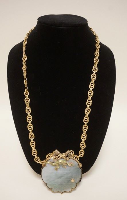 1001	18K GOLD CHAIN W/JADE PENDANT, CHAIN IS UNOAERRE ARREZZO ITALY, CHAIN WEIGHS 37.4 DWT, PENDANT W/CARVED ASIAN CHARACTERS MARKS, HAS ATTACHED LIZARD W/STONES, PENDANT MOUNT TESTS 14K GOLD
