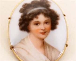 1008	PORCELAIN OVAL BROOCH/PIN W/IMAGE OF YOUNG WOMAN, APPROXIMATELY 2 IN HIGH
