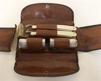 1014	TIFFANY & CO 1907 SHAVING KIT INCLUDING STERLING CONTAINER 2.0 OZT & STERLING SHAVING BRUSH, 2 STRAIGHT RAZORS & STRAP, ONE FLAP DETACHED ON POUCH
