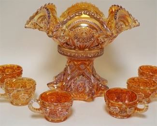 1030	CARNIVAL GLASS PUNCH BOWL W/6 CUPS, SMALL CHIP ON BASE, APPROXIMATELY 10 IN HIGH
