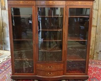 1086	MAHOGANY TRIPLE DOOR 2 DRAWER INLAID BOOKCASE, CENTER GLASS DOOR HAS BOW FRONT, ALL SHELVES ADJUSTABLE, APPROXIMATELY 63 IN X 18 IN X 66 IN HIGH
