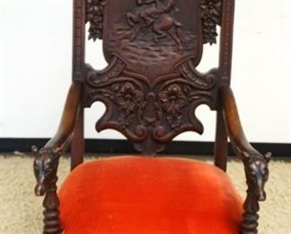 1089	HEAVILY CARVED WALNUT LARGE THRONE CHAIR W/HUNT SCENE & DOG HEAD ARM ENDS, APPROXIMATELY 62 IN HIGH
