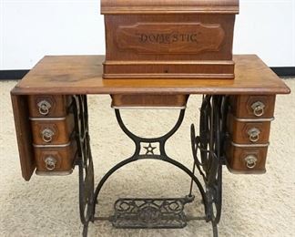 1102	ANTIQUE *DOMESTIC* TREADLE SEWING MACHINE IN OAK CASE, APPROXIMATELY 36 IN X 17 IN X 39 IN HIGH
